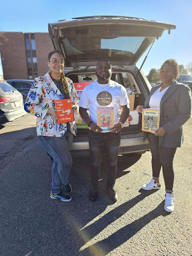 Handing over a fresh delivery of donated books