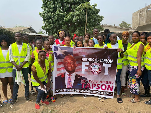 Marching in the community sport parade with the Friends of Tapson banner