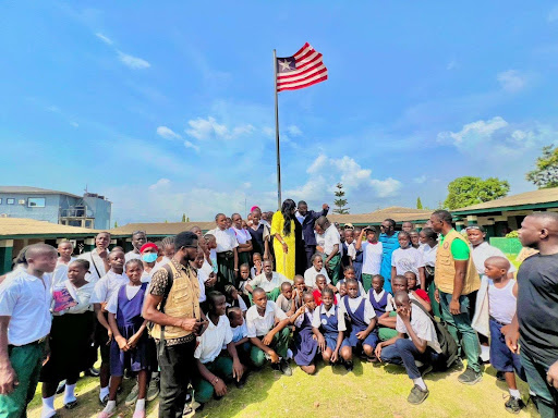 Students and staff gather for a flag ceremony at the school