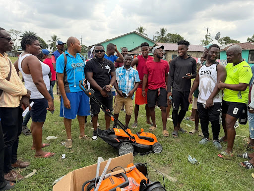 The community with the newly donated lawn mowers
